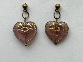 Pair of heart-shaped, oxidized gold earrings with pansy design.